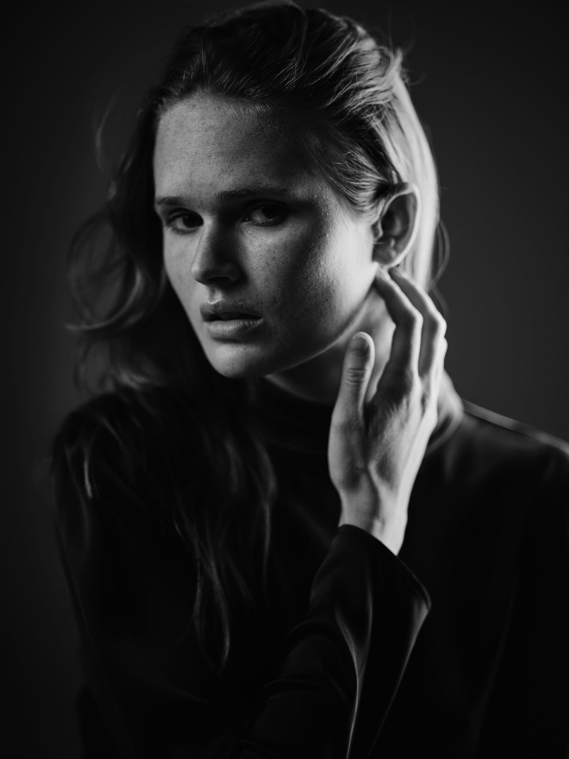 Fine art black and white chiaroscuro portrait by Henry David, sculptural studio lighting, heirloom portraiture