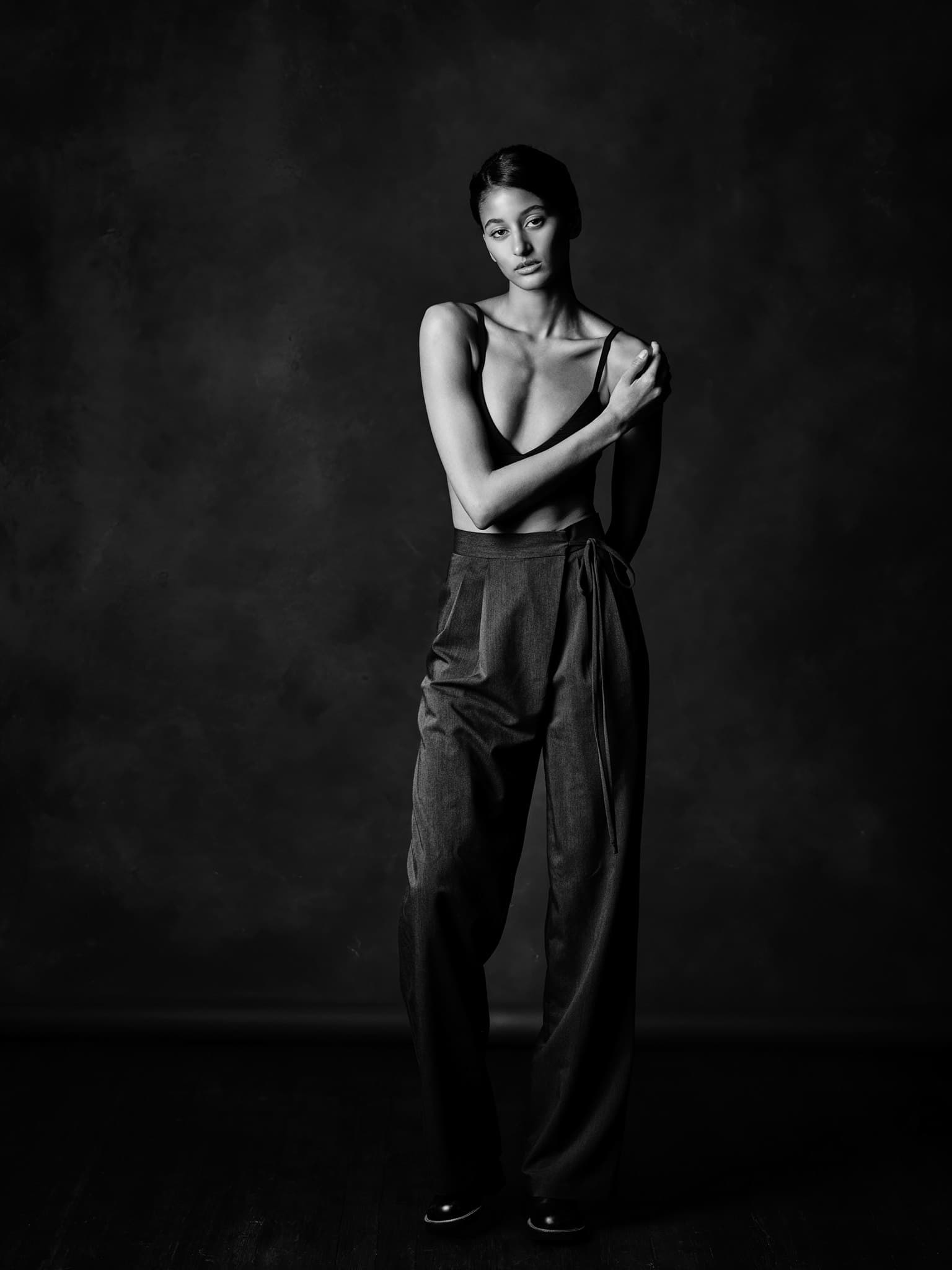 Full-length fine art black and white portrait, painterly low-key studio lighting, by Henry David