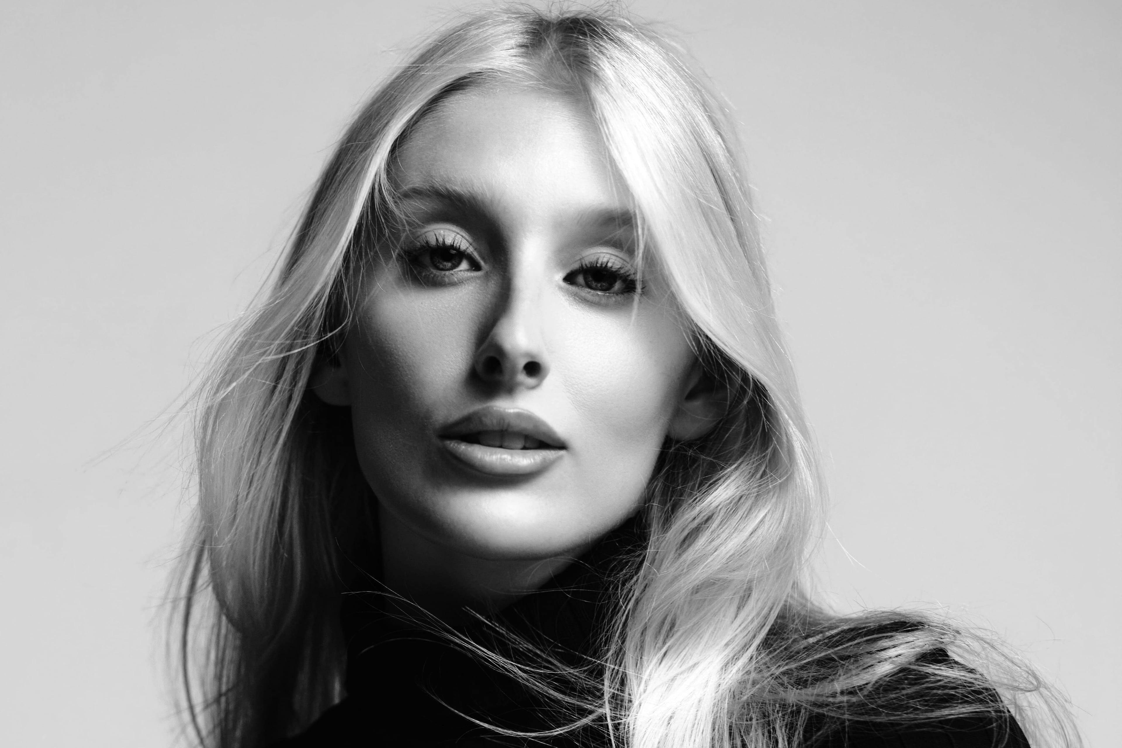 Elizabeth Nichole Jones in a black rib-knit turtleneck, close, black and white