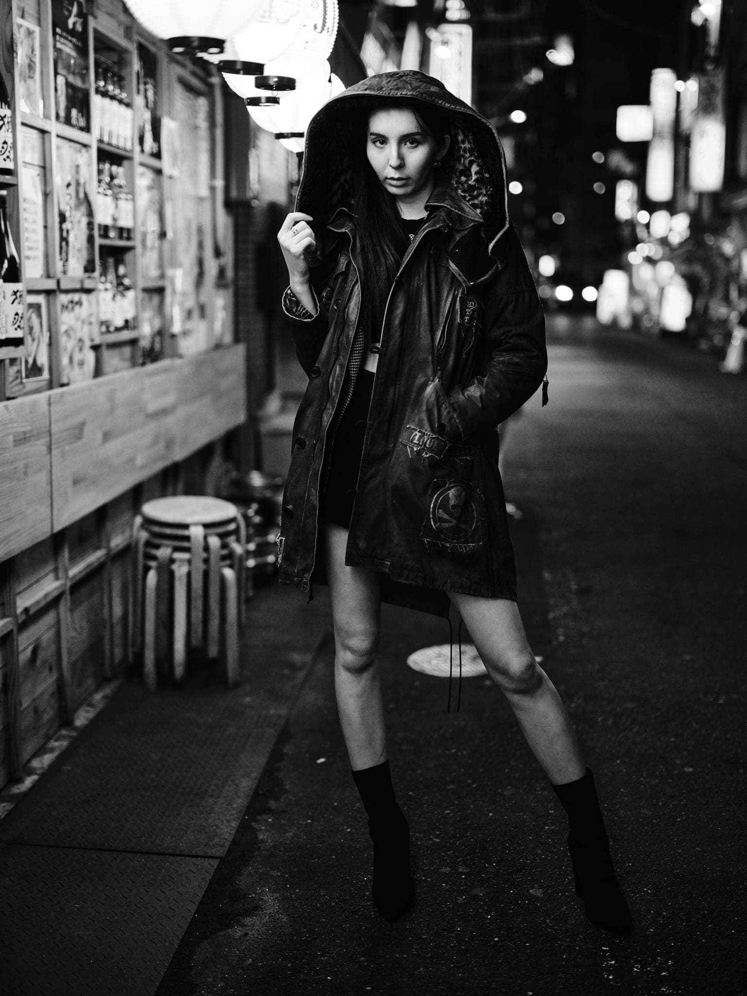 Model in oversized leather jacket, izakaya alley, Shimbashi
